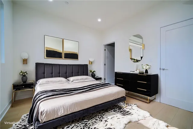 a bedroom with a bed and a dresser