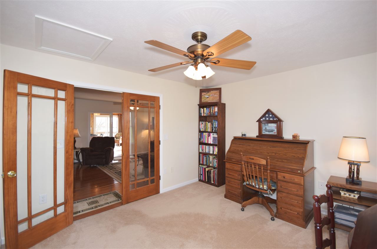 4613 Conicville Road Mount Jackson, VA 22842 - Photo 15 of 35 a bedroom with furniture and a chandelier