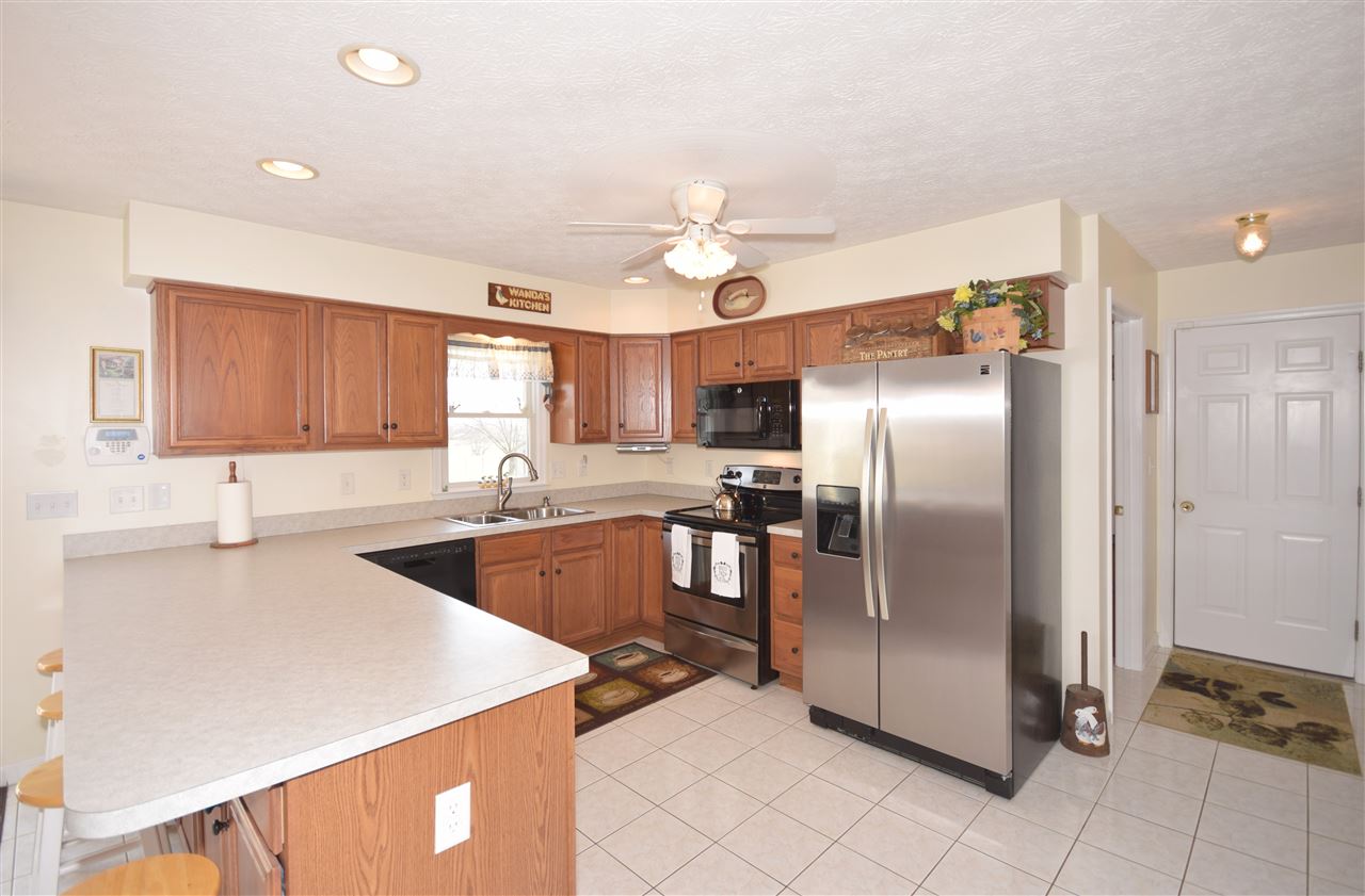 4613 Conicville Road Mount Jackson, VA 22842 - Photo 5 of 35 a kitchen with stainless steel appliances granite countertop a refrigerator a sink a stove and island