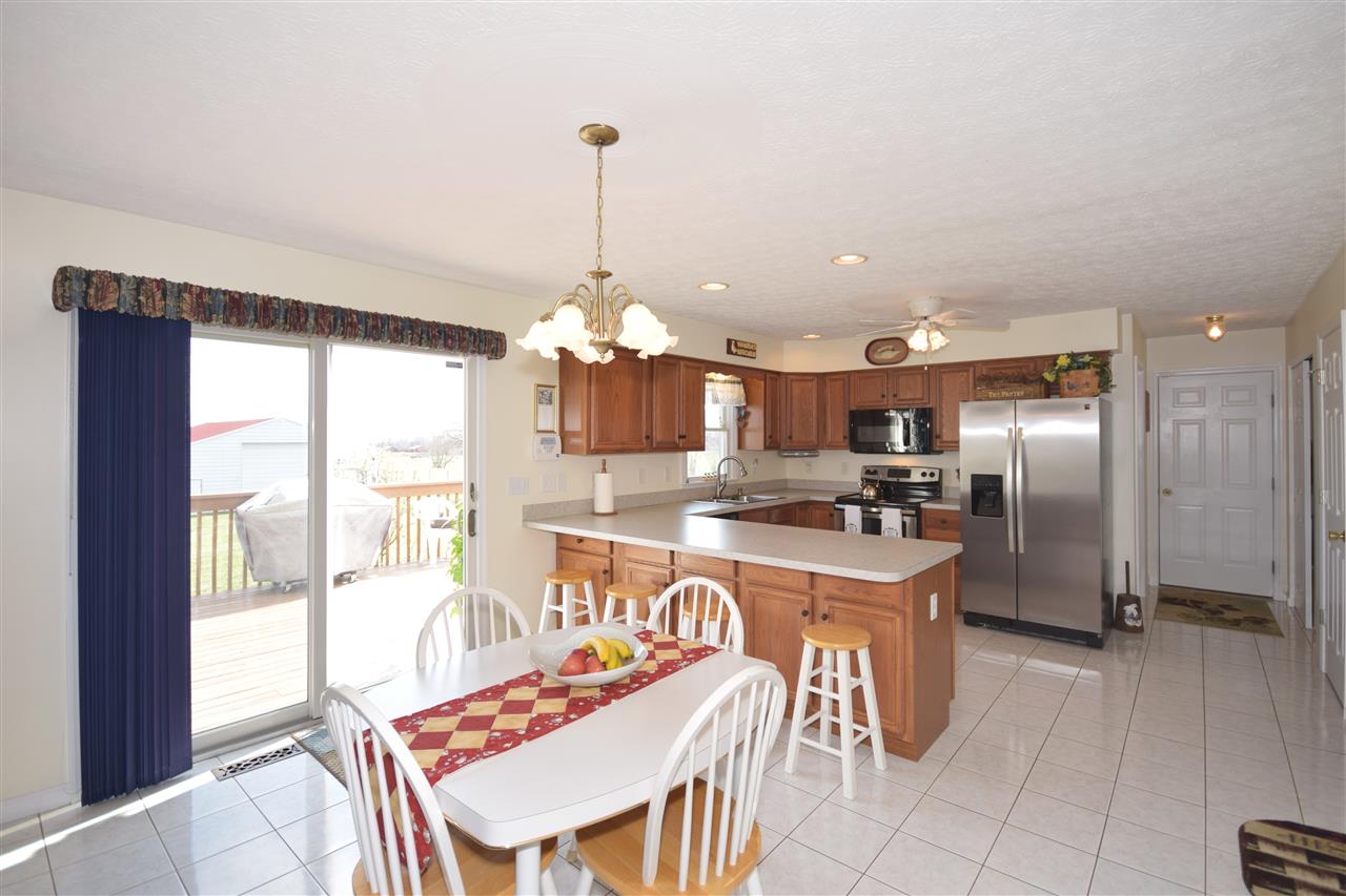 4613 Conicville Road Mount Jackson, VA 22842 - Photo 6 of 35 a kitchen with stainless steel appliances kitchen island granite countertop a sink a stove and a refrigerator
