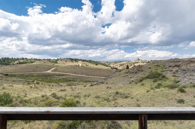 a view of balcony with furniture