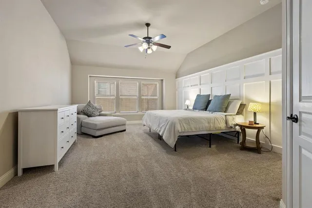 a bedroom with bed and window