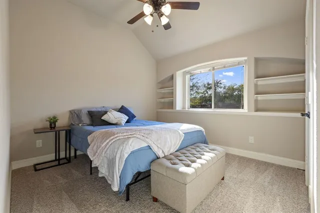 a bedroom with bed and window