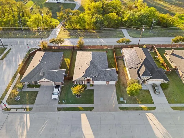 an aerial view of a house with a swimming pool
