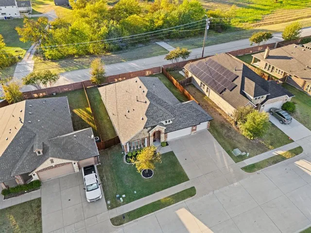 an aerial view of a house with a swimming pool