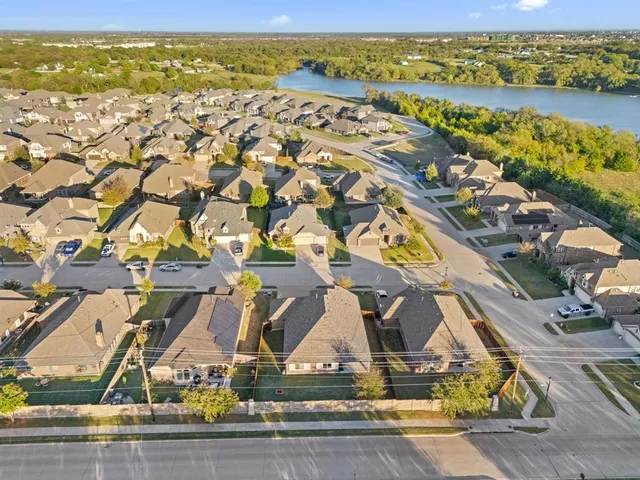 an aerial view of residential houses with outdoor space
