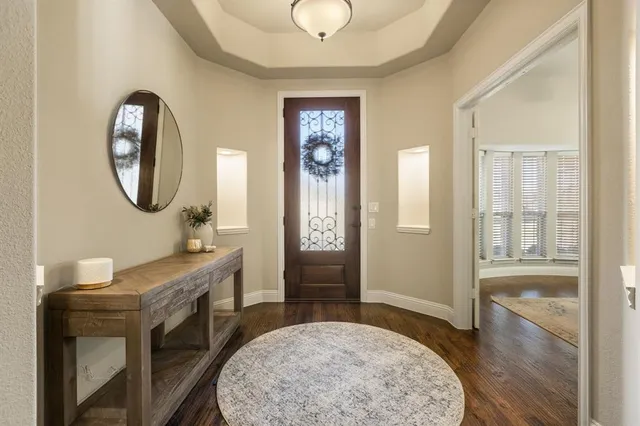 a spacious bathroom with a sink a mirror and a shower