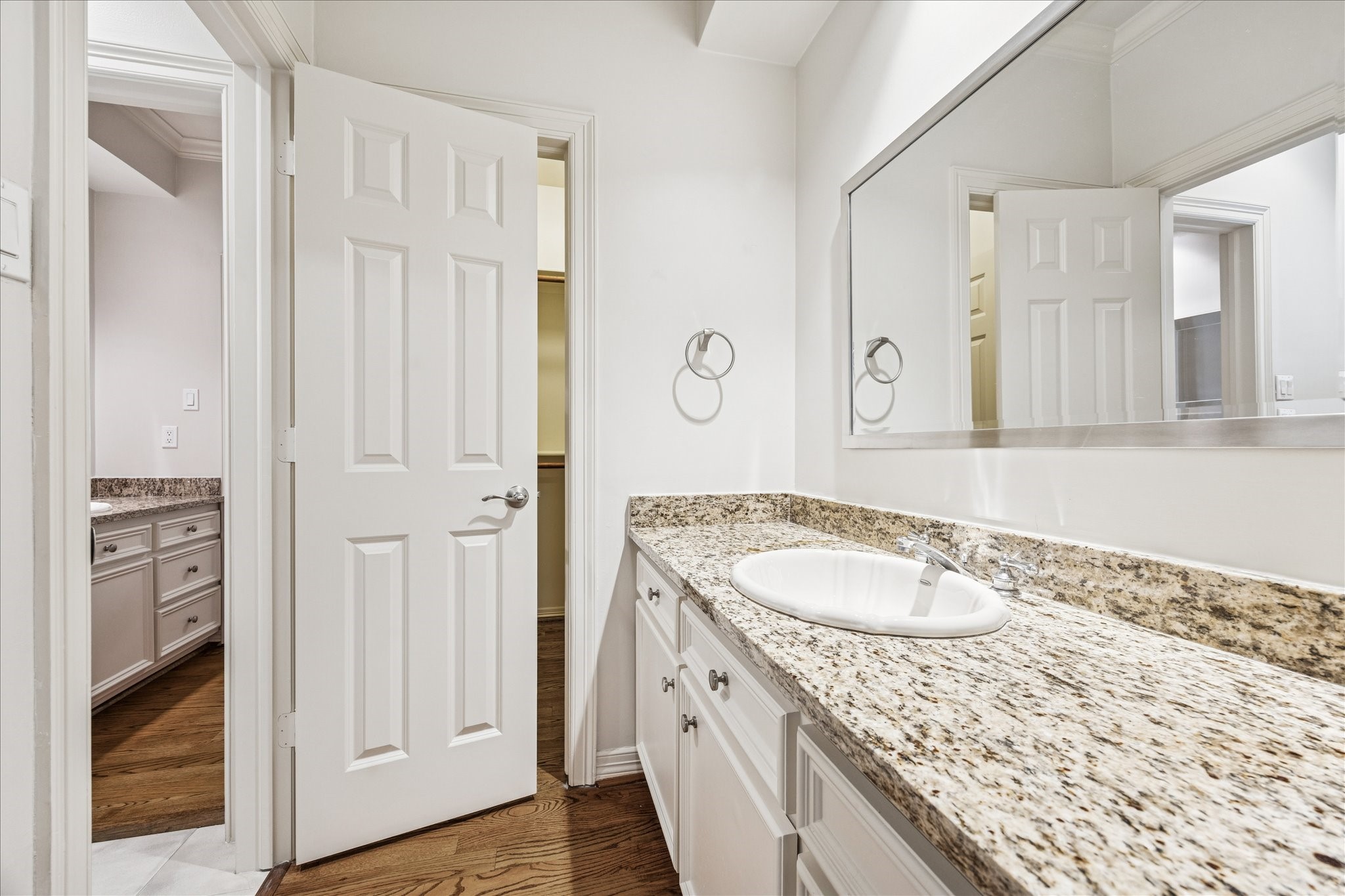 5823 Augusta Court Houston, TX 77057 - Photo 34 of 44 The third floor full bathroom with a granite countertop, an undermount sink, and a large mirror is accessed off of the spacious living area.