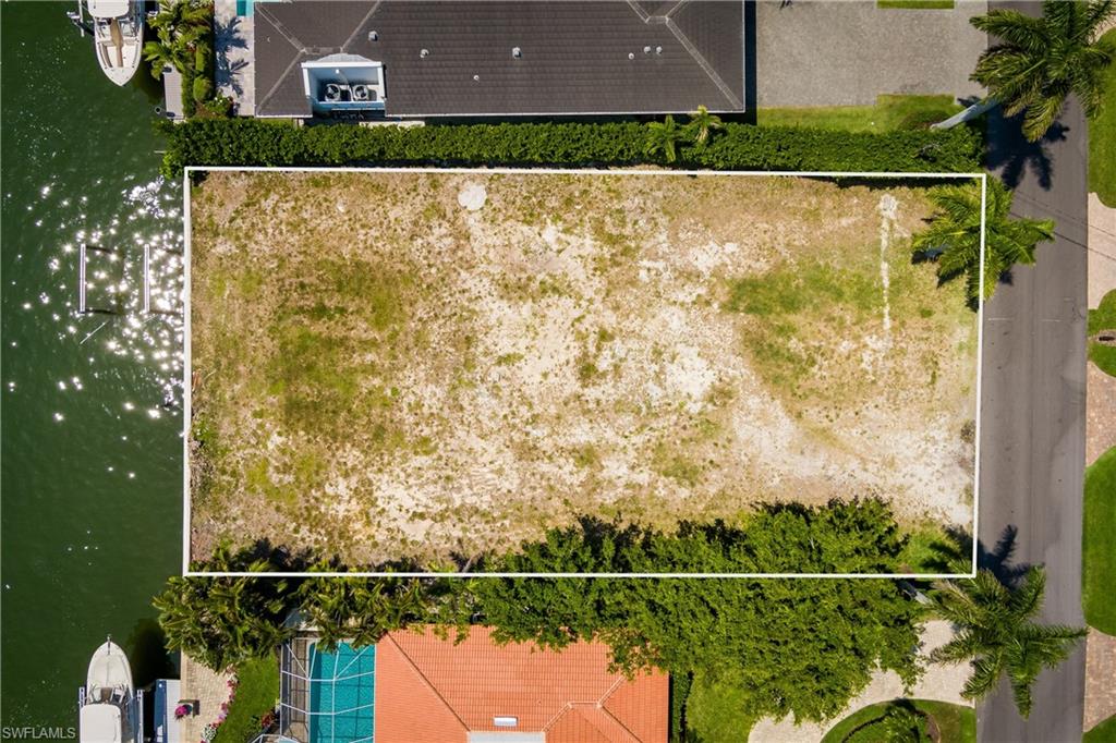 2165 Tarpon Road Naples, FL 34102 - Photo 13 of 24 a view of outdoor space and yard