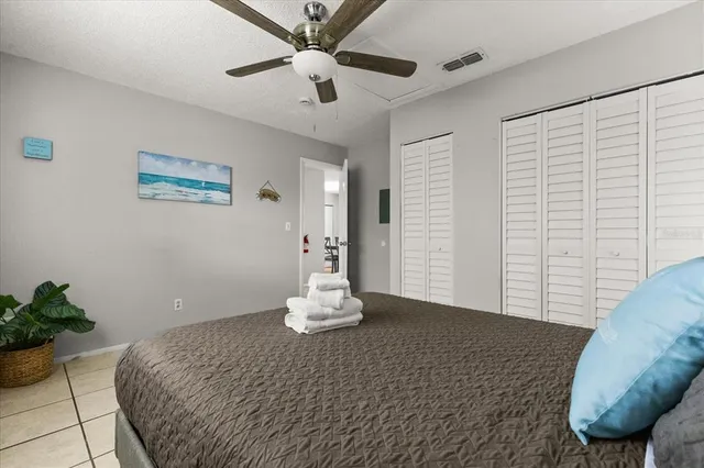 a bedroom with a bed and a lamp on table