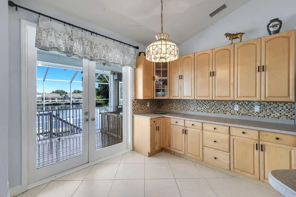 a view of a kitchen with a dishwasher cabinets and furniture