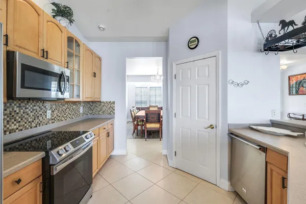 a kitchen with stainless steel appliances granite countertop a stove and a refrigerator