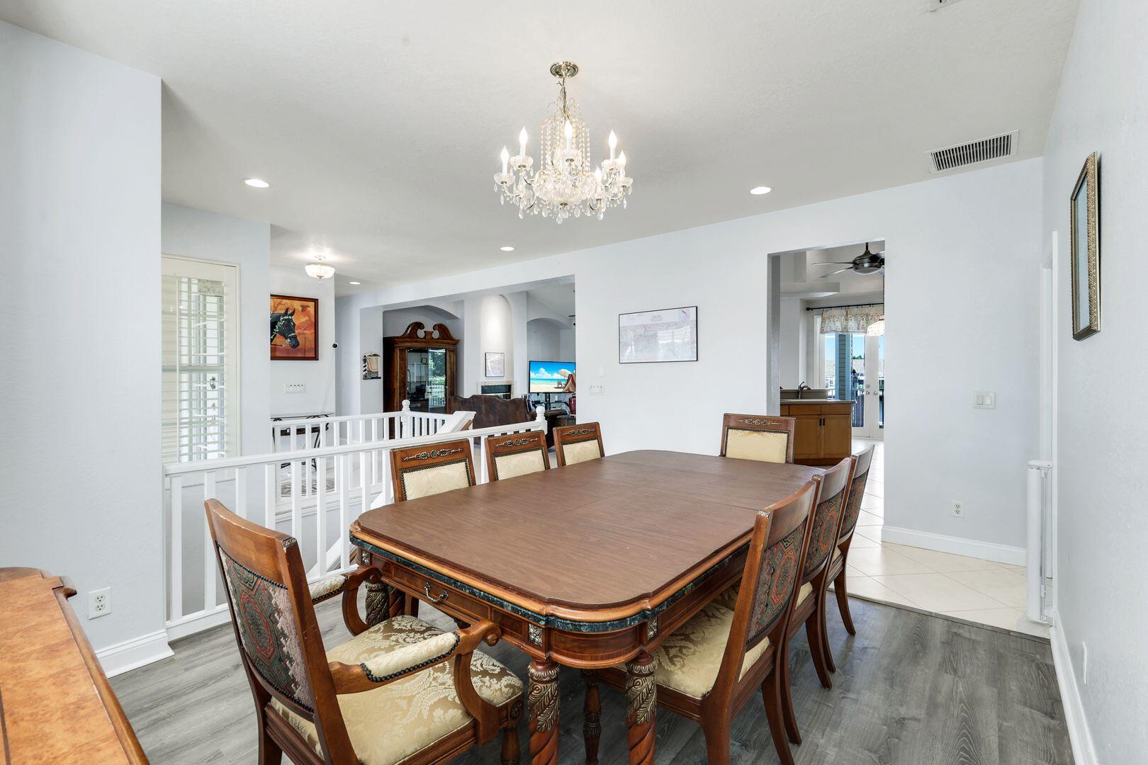183 Sunset Cay Naples, FL 34114 - Photo 17 of 45 a view of a dining room with furniture and wooden floor
