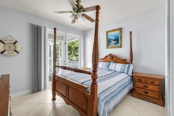 a bed room with a bed and a window