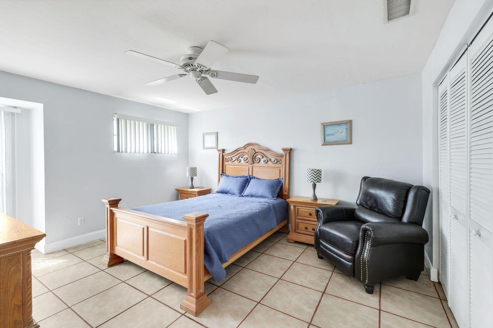 183 Sunset Cay Naples, FL 34114 - Photo 25 of 45 a bedroom with a bed and window