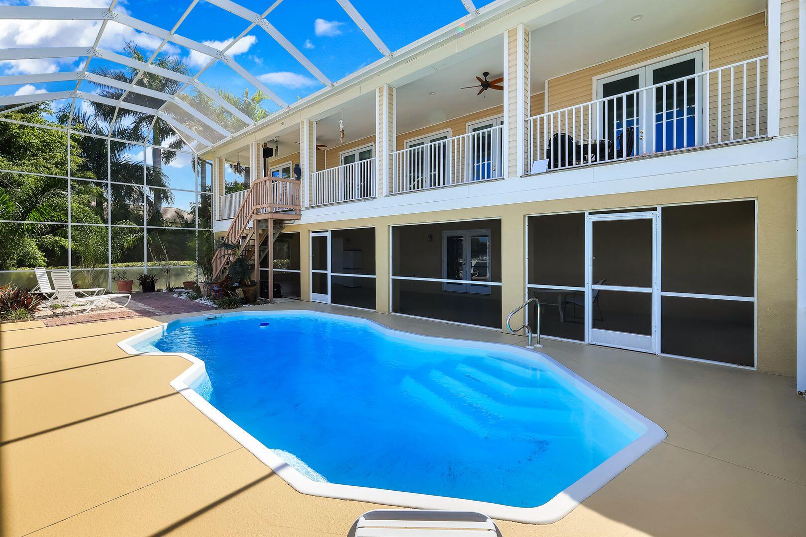 183 Sunset Cay Naples, FL 34114 - Photo 33 of 45 a view of an empty room with wooden floor and windows
