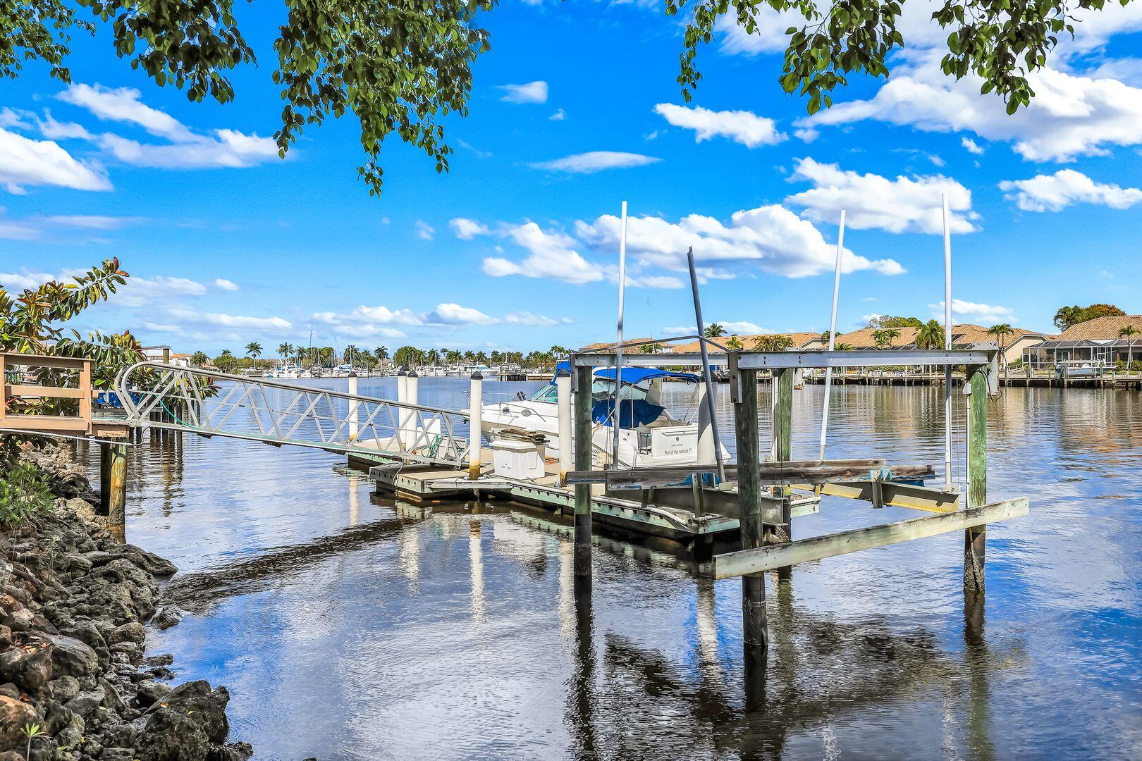 183 Sunset Cay Naples, FL 34114 - Photo 38 of 45 a view of a terrace with outdoor seating and city view