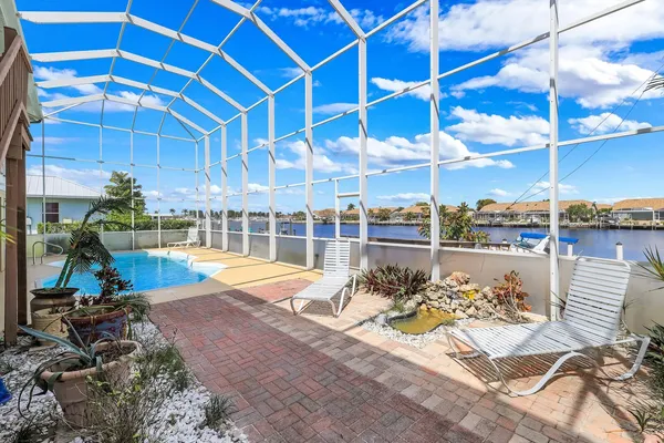 a view of a swimming pool with a lounge chair