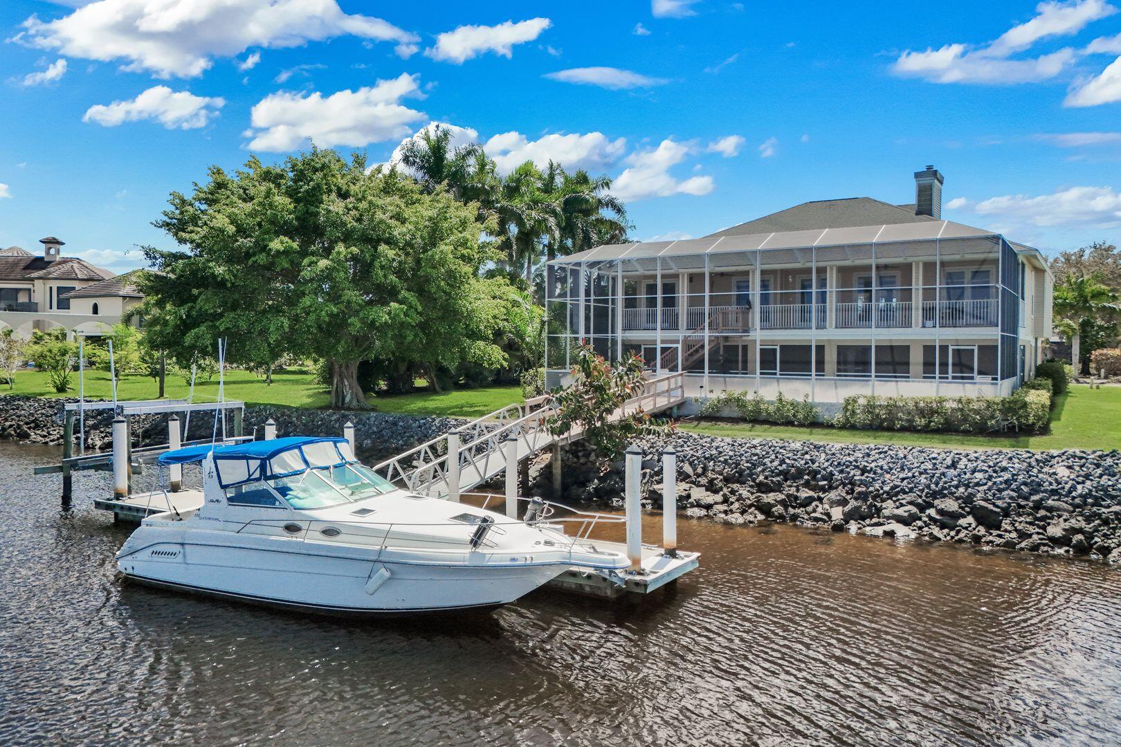 183 Sunset Cay Naples, FL 34114 - Photo 7 of 45 a view of a house with a yard and sitting area
