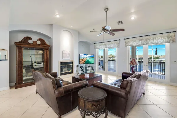 a living room with furniture a chandelier and a chandelier