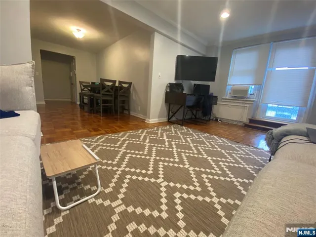 a lobby with furniture and a rug