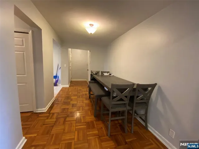 a view of a hallway with seating area