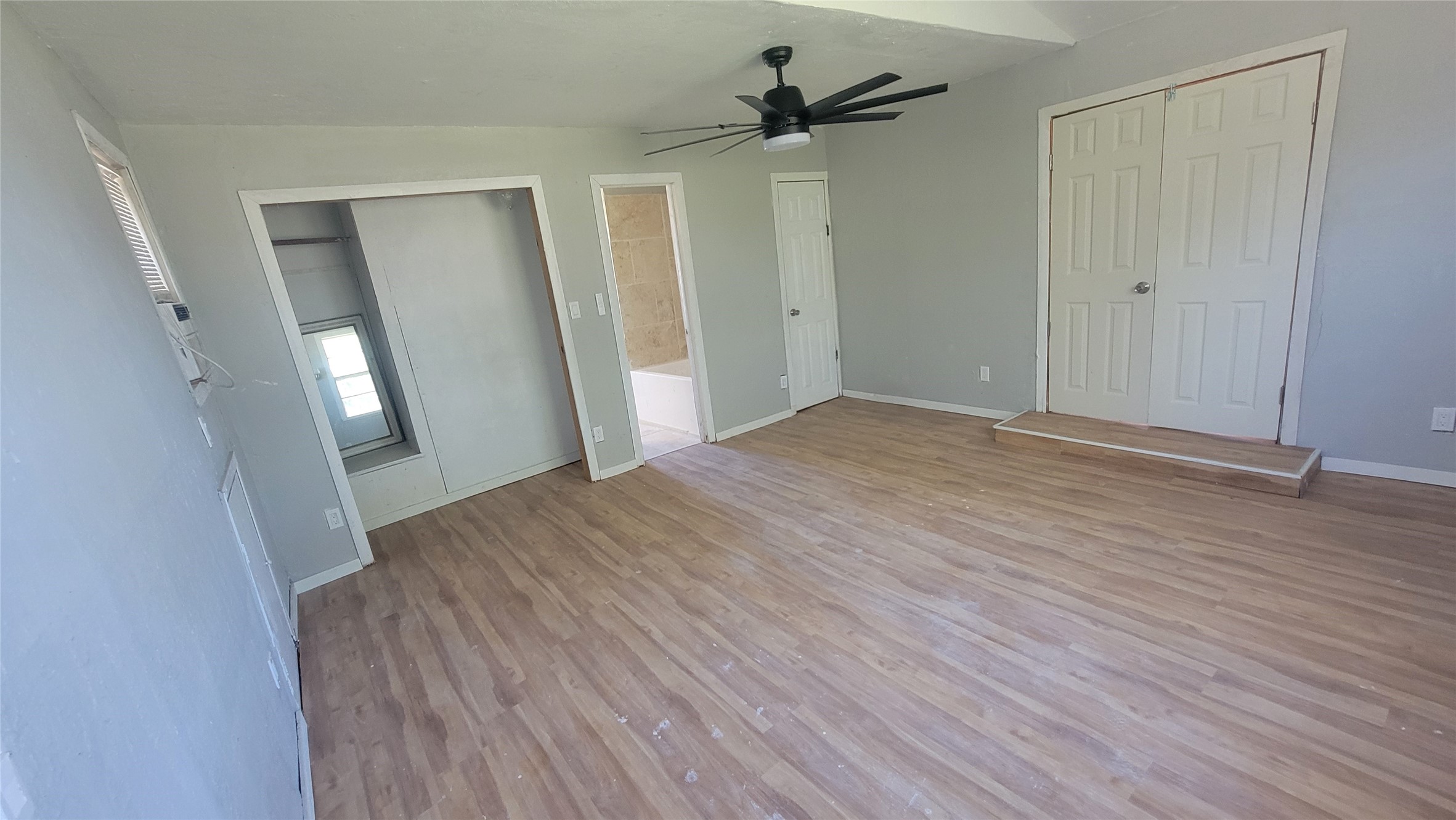 12018 Sandpiper Road Angleton, TX 77515 - Photo 19 of 48 a view of empty room with wooden floor and fan
