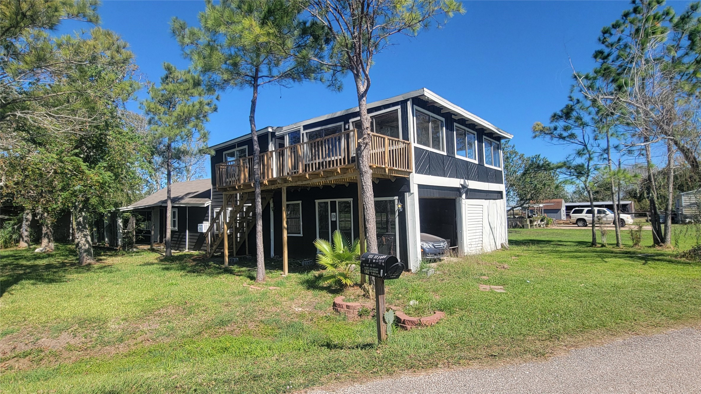 12018 Sandpiper Road Angleton, TX 77515 - Photo 43 of 48 a front view of a house with a yard