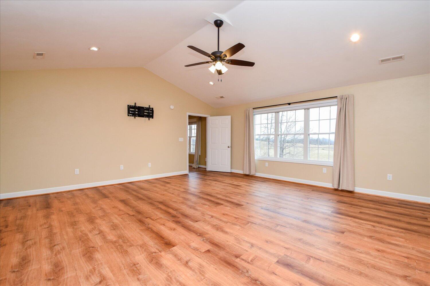 5515 Breckinridge Mill Road Fincastle, VA 24090 - Photo 12 of 31 wooden floor in an empty room with a window