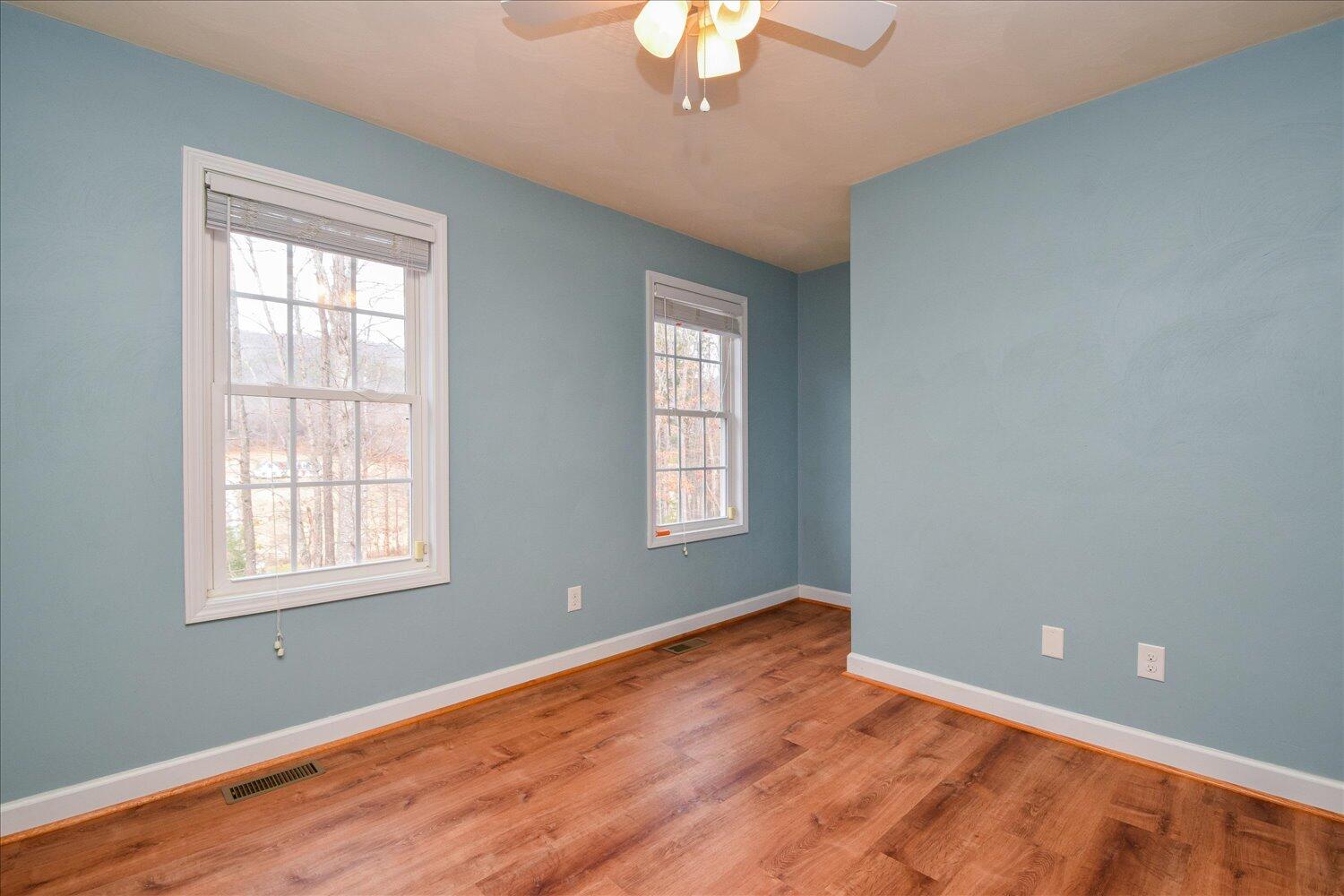 5515 Breckinridge Mill Road Fincastle, VA 24090 - Photo 22 of 31 a view of an empty room with wooden floor and a window