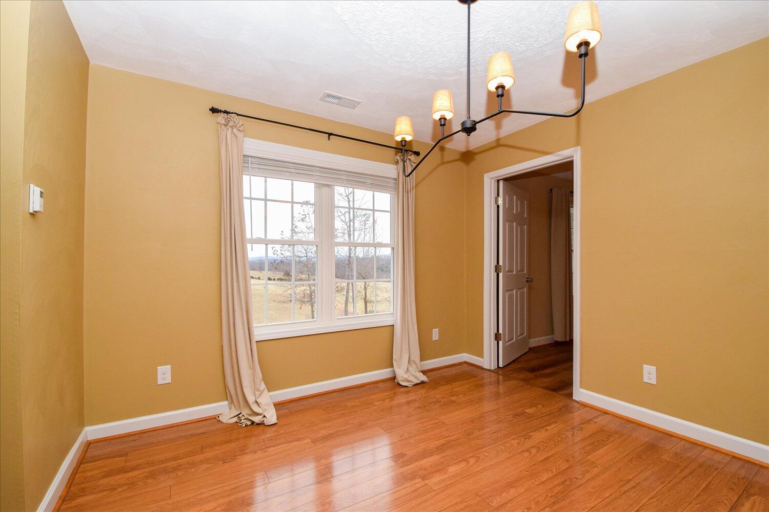 5515 Breckinridge Mill Road Fincastle, VA 24090 - Photo 5 of 31 a view of an empty room with a window