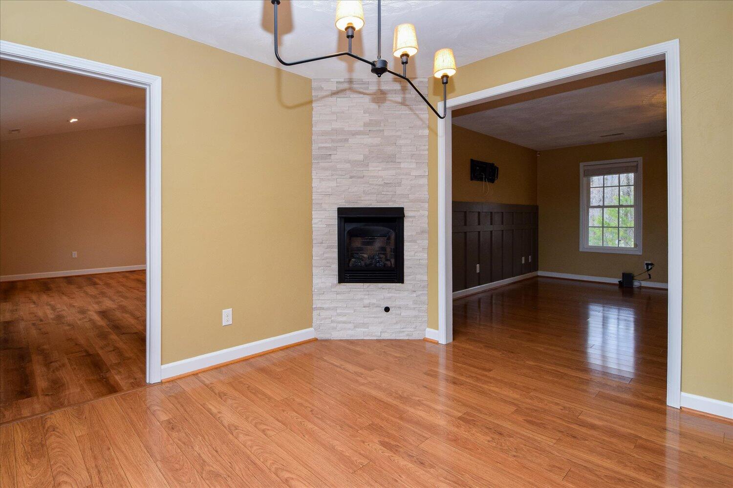 5515 Breckinridge Mill Road Fincastle, VA 24090 - Photo 6 of 31 a view of a livingroom with wooden floor and a ceiling fan