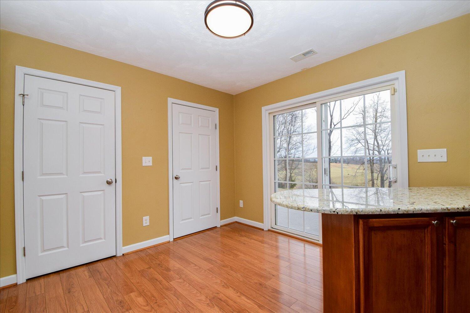 5515 Breckinridge Mill Road Fincastle, VA 24090 - Photo 10 of 31 a view of a livingroom with wooden floor and cabinet