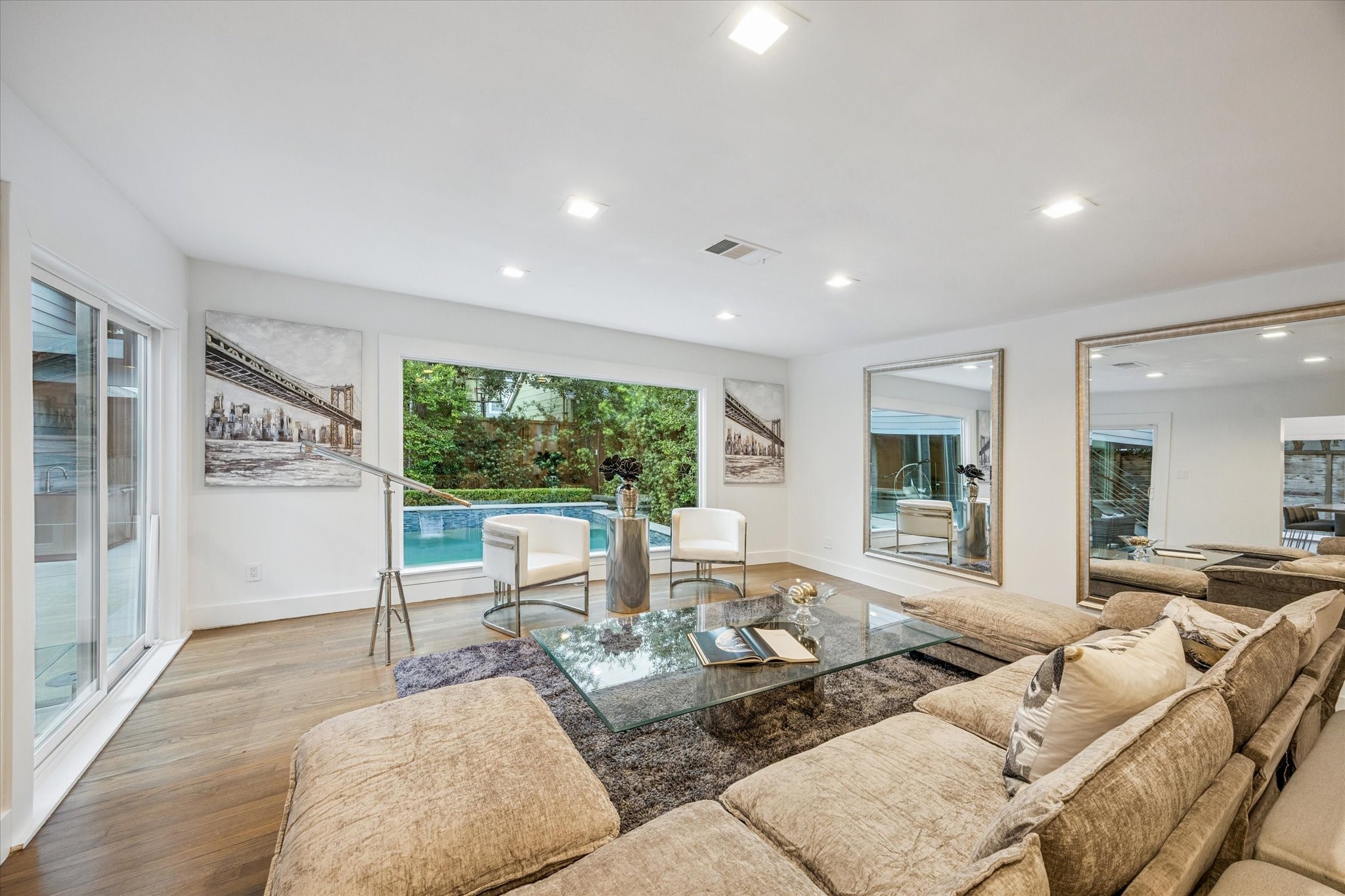 2420 Locke Lane Houston, TX 77019 - Photo 16 of 37 The Family Room is flooded with tons of natural light thanks to the large picture window and sliding door.