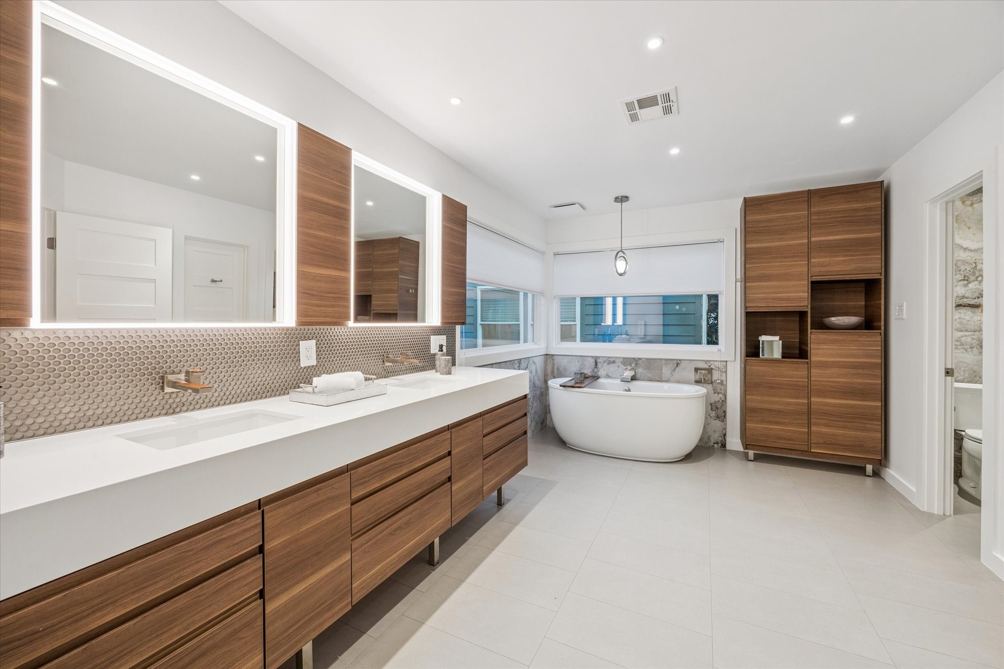 2420 Locke Lane Houston, TX 77019 - Photo 21 of 37 Another view of the beautiful Primary Bathroom showing a view of the soaking tub with stone backsplash.