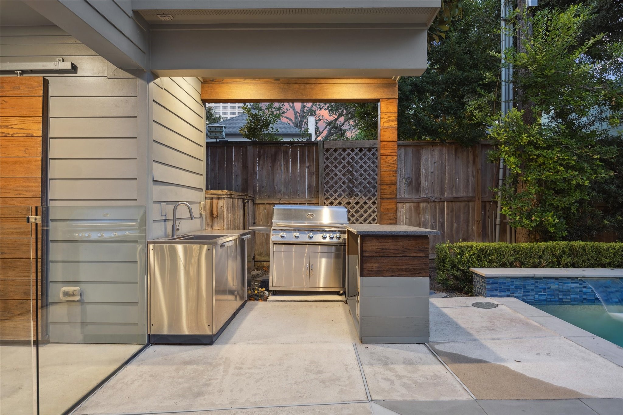 2420 Locke Lane Houston, TX 77019 - Photo 32 of 37 Another great feature of the house is this summer kitchen adjacent to the pool which features a grill, sink, mini fridge and bar.