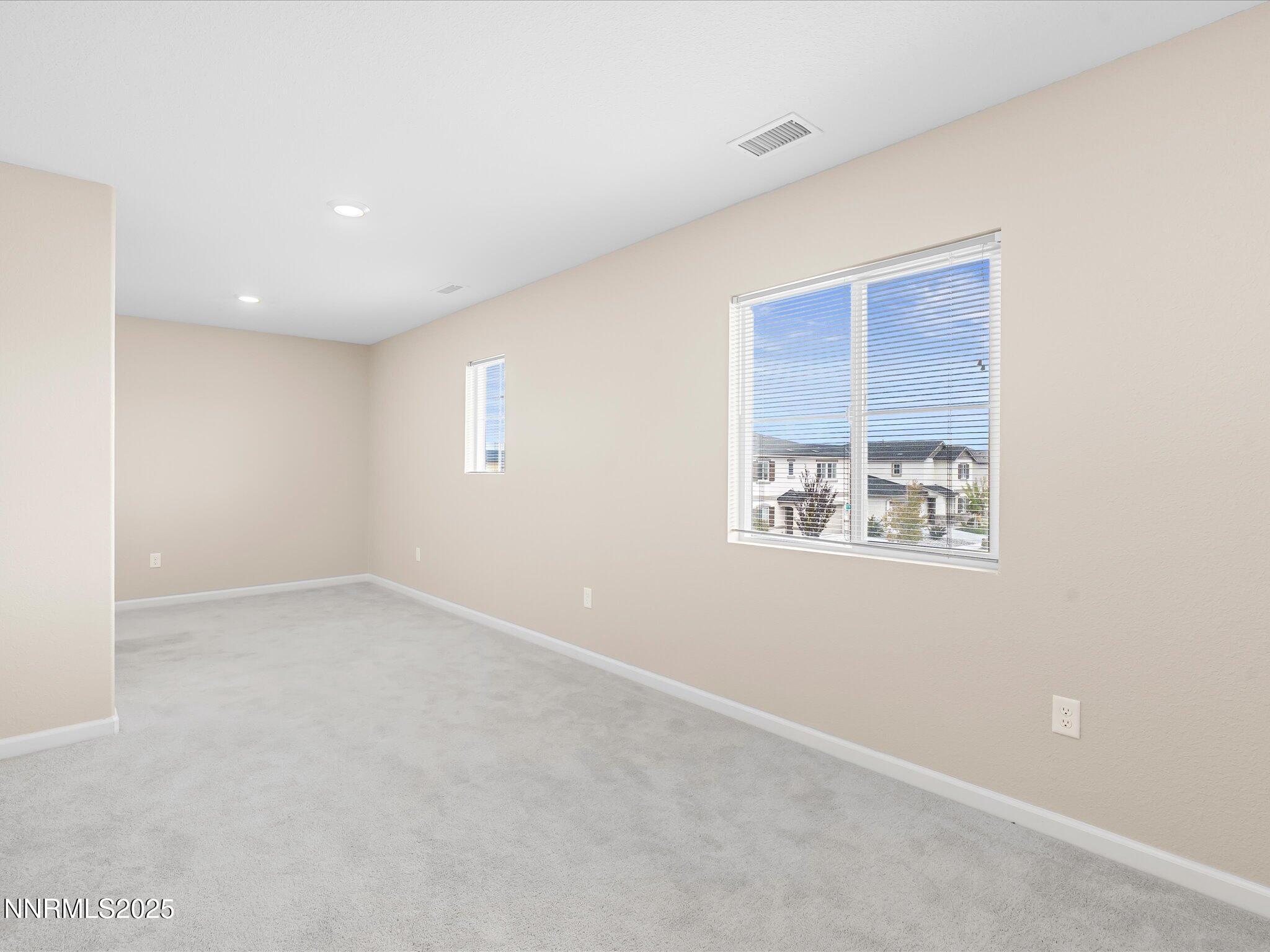 8933 Quail Falls Drive Reno, NV 89506 - Photo 12 of 22 an empty room with a window