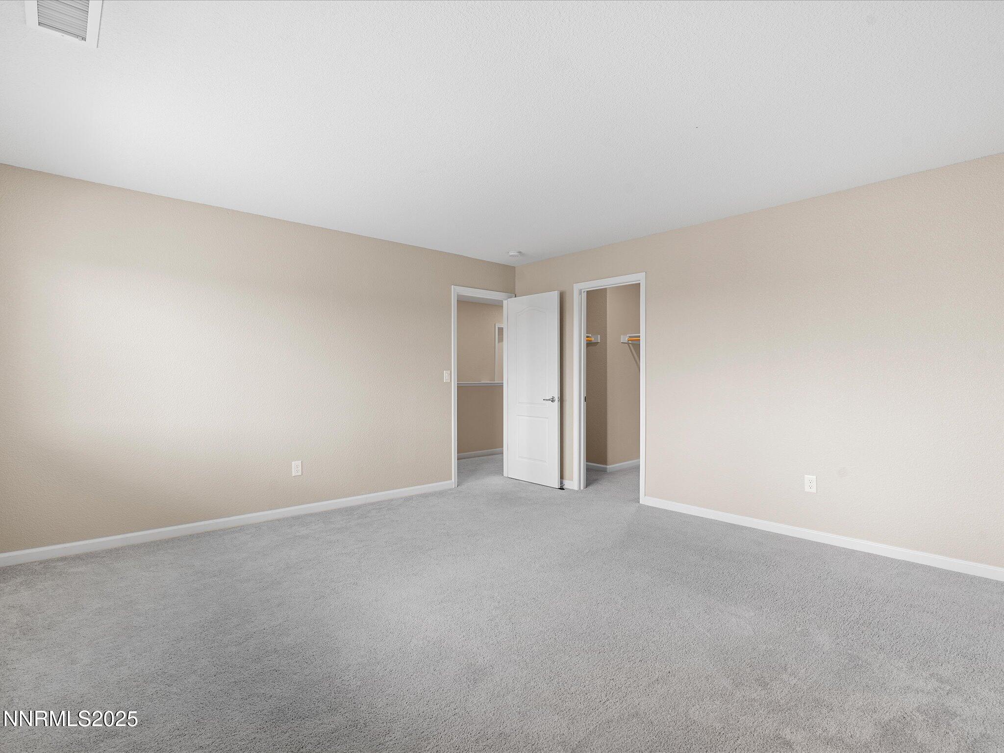8933 Quail Falls Drive Reno, NV 89506 - Photo 13 of 22 a view of an empty room and a window