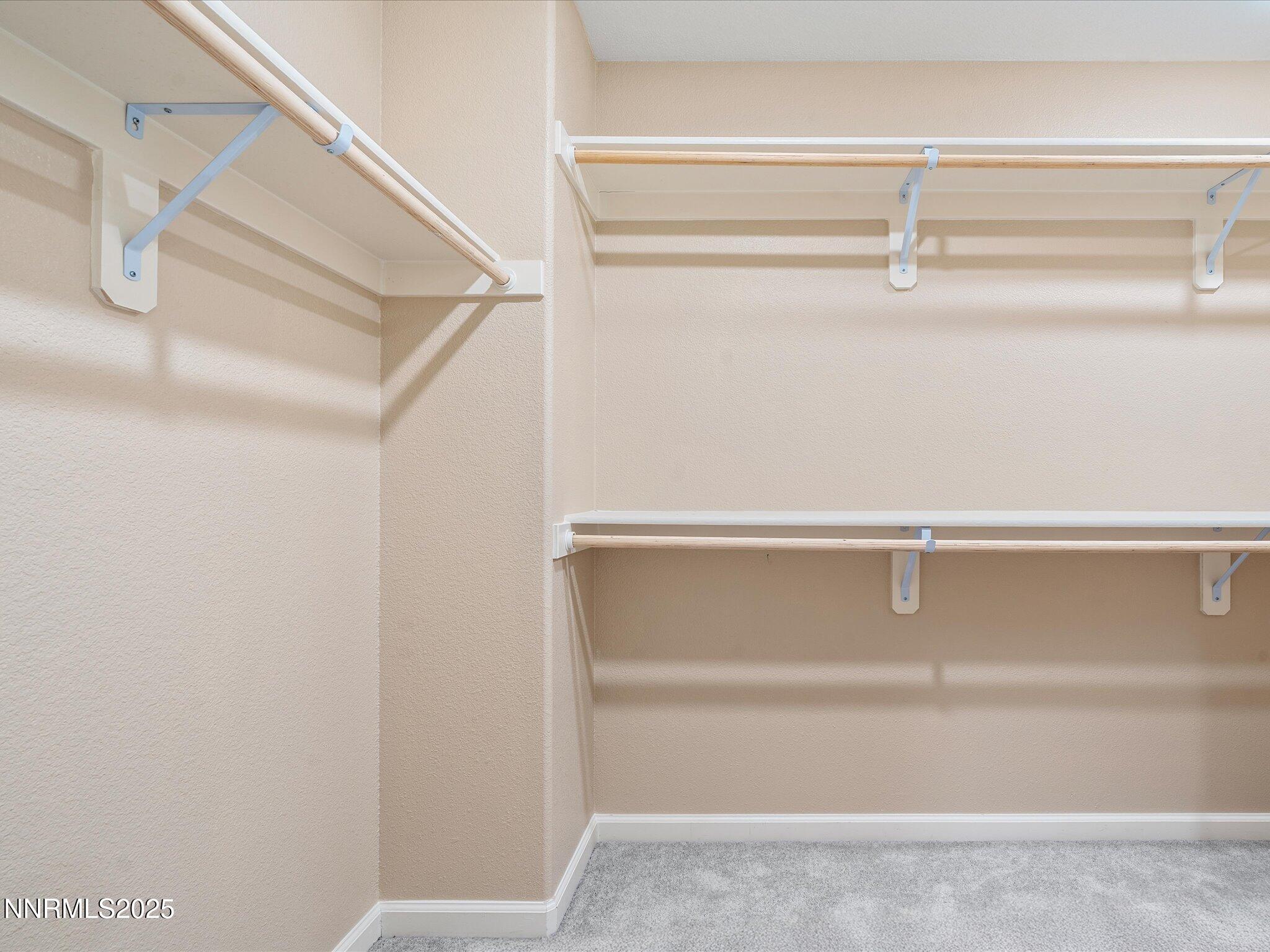 8933 Quail Falls Drive Reno, NV 89506 - Photo 15 of 22 a view of walk in closet with empty racks
