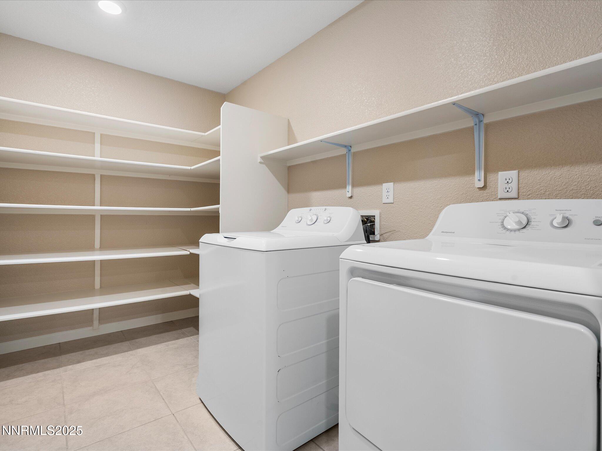 8933 Quail Falls Drive Reno, NV 89506 - Photo 16 of 22 a utility room with dryer and washer