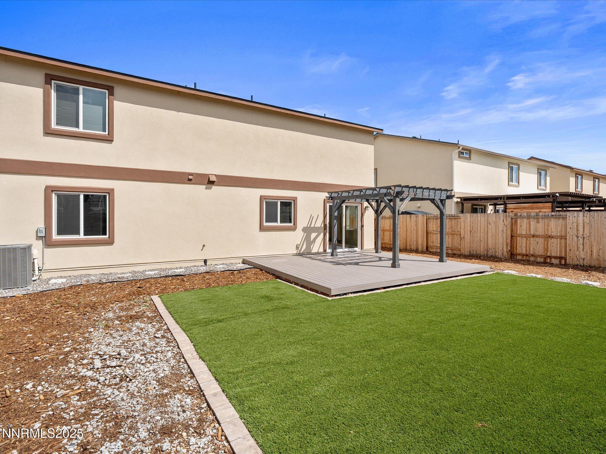8933 Quail Falls Drive Reno, NV 89506 - Photo 19 of 22 a view of a house with a backyard