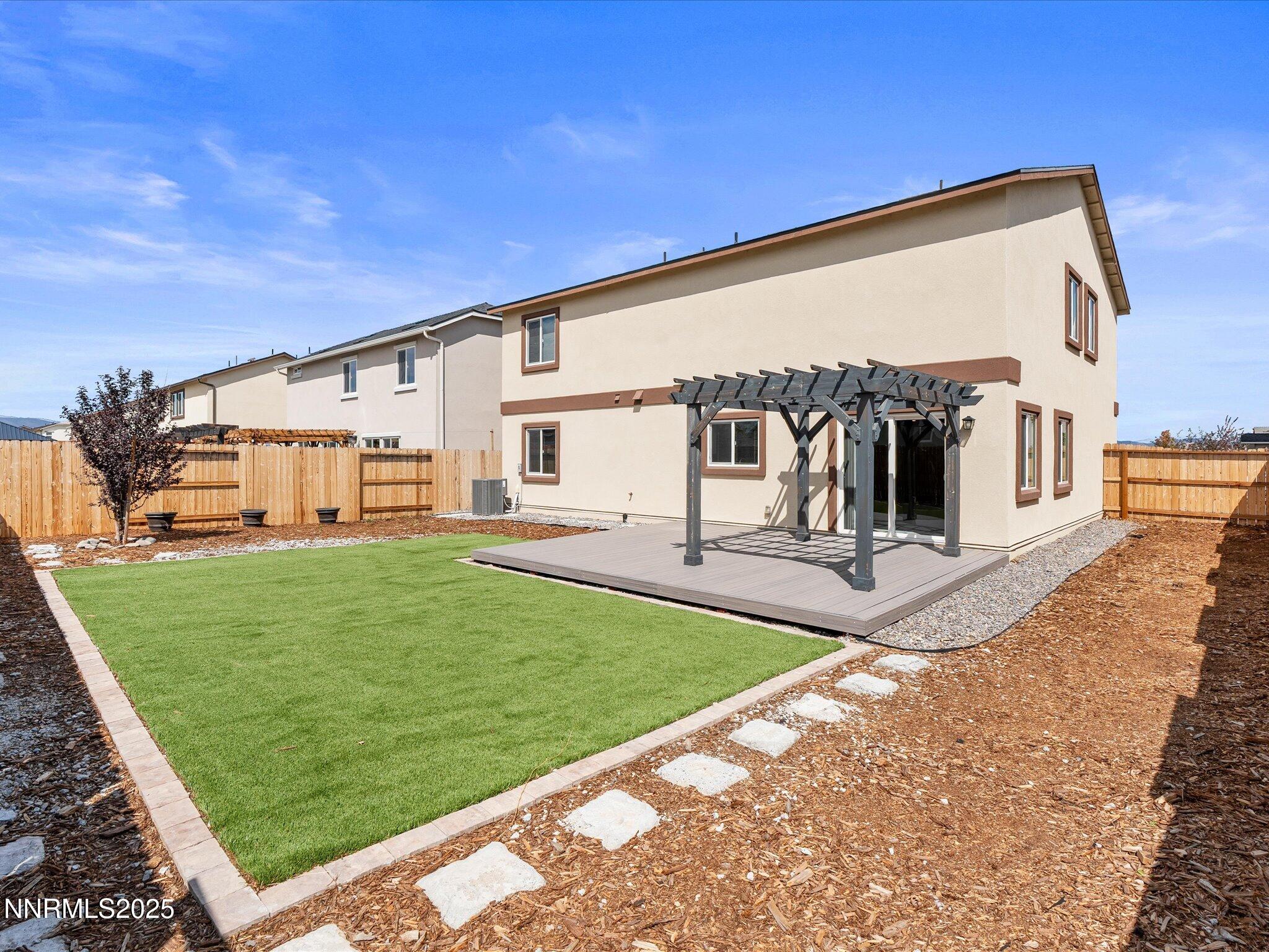 8933 Quail Falls Drive Reno, NV 89506 - Photo 20 of 22 a view of a house with a backyard