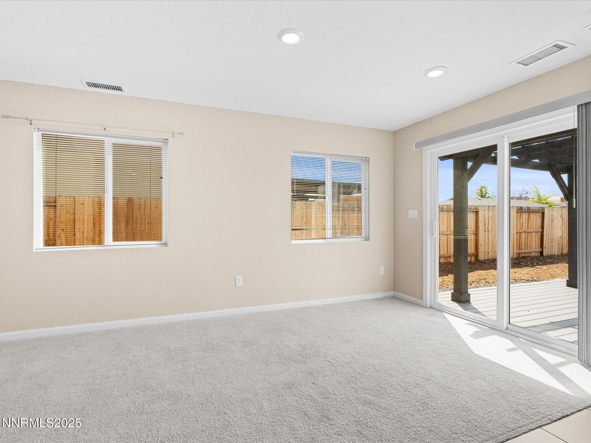 8933 Quail Falls Drive Reno, NV 89506 - Photo 7 of 22 an empty room with windows
