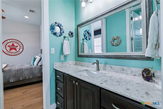 a bathroom with a sink and a mirror