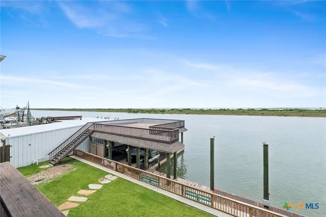 a view of a balcony with lake view and a large window