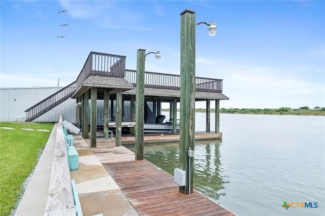 a view of a room with a table and chairs
