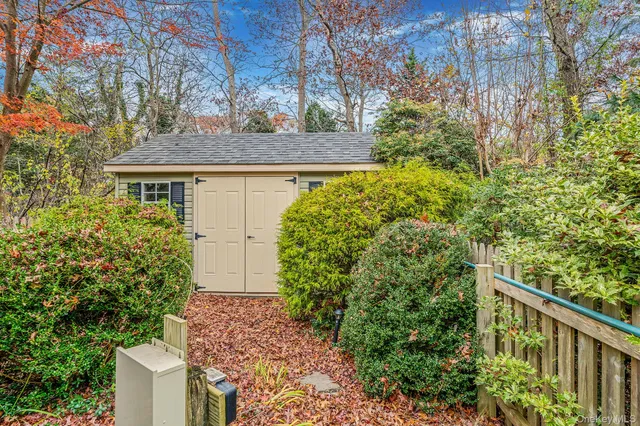 a view of a house with a tree