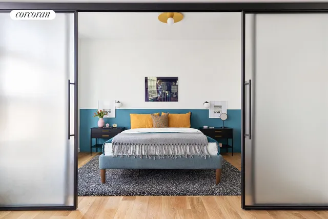 a bedroom with a bed and window