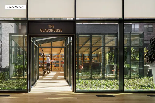 a view of building with glass door