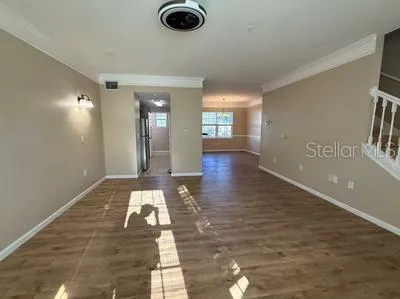 a view of a kitchen with a sink and a kitchen counter top space